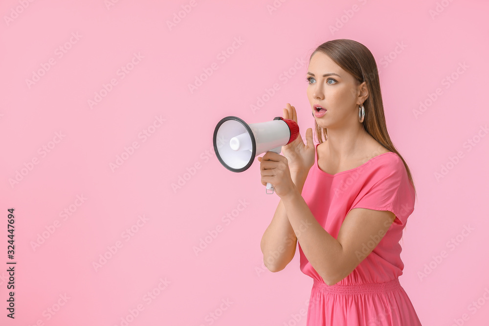 Young woman with megaphone on color background Young woman with megaphone on color background