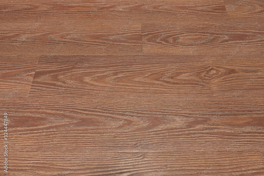 Obraz premium Natural dark brown wooden surface floor texture background. polished laminate parquet