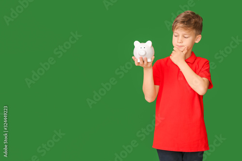Thoughtful cute boy with pi...