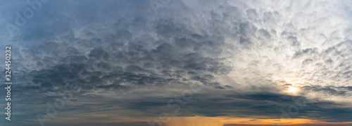 Fantastic dark thunderclouds at sunrise