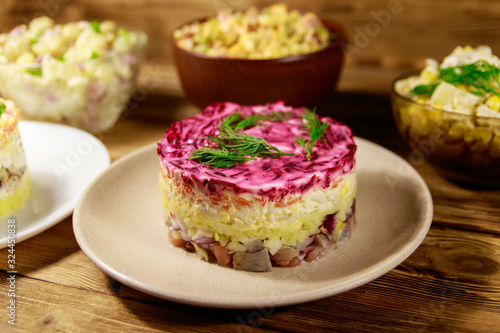 Wallpaper Mural Set of festive mayonnaise salads on wooden table Torontodigital.ca