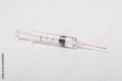 Macro closeup of syringe on white background