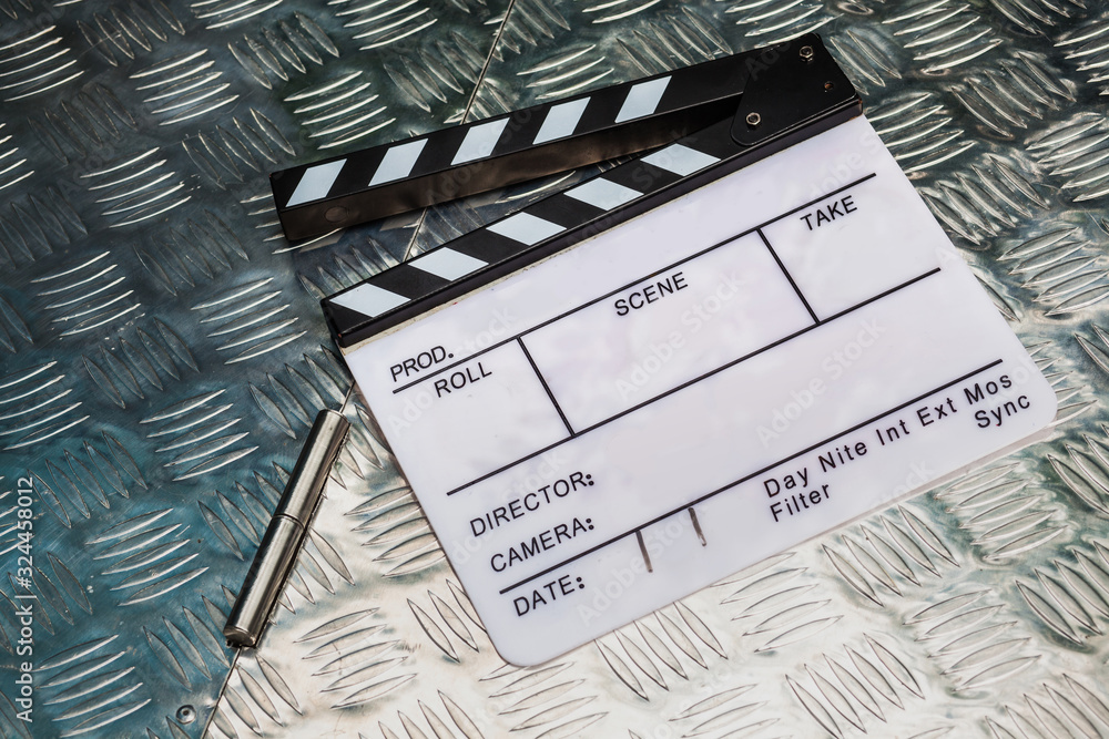 Fototapeta premium Clapperboard on metallic box surface background
