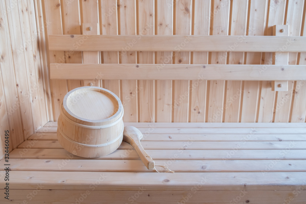 Wooden sauna bucket on bench Wooden sauna bucket on bench