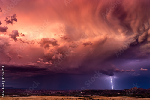 Stormy sky with lightning at sunset