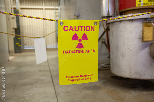 A sign warning personnel of ionizing radiation danger around klystron equipment.