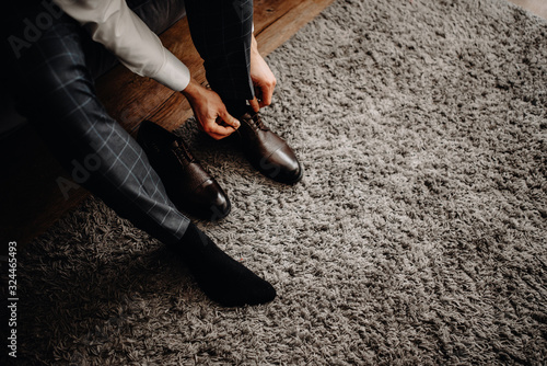 Business man knot shoe lace indoor