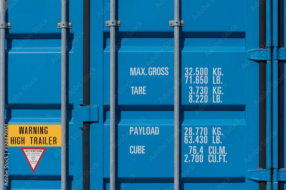 Door of new manufactured blue 40' high cube container as for industry shipping business background.