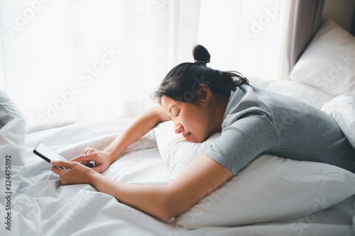 sleeping woman with smartphone