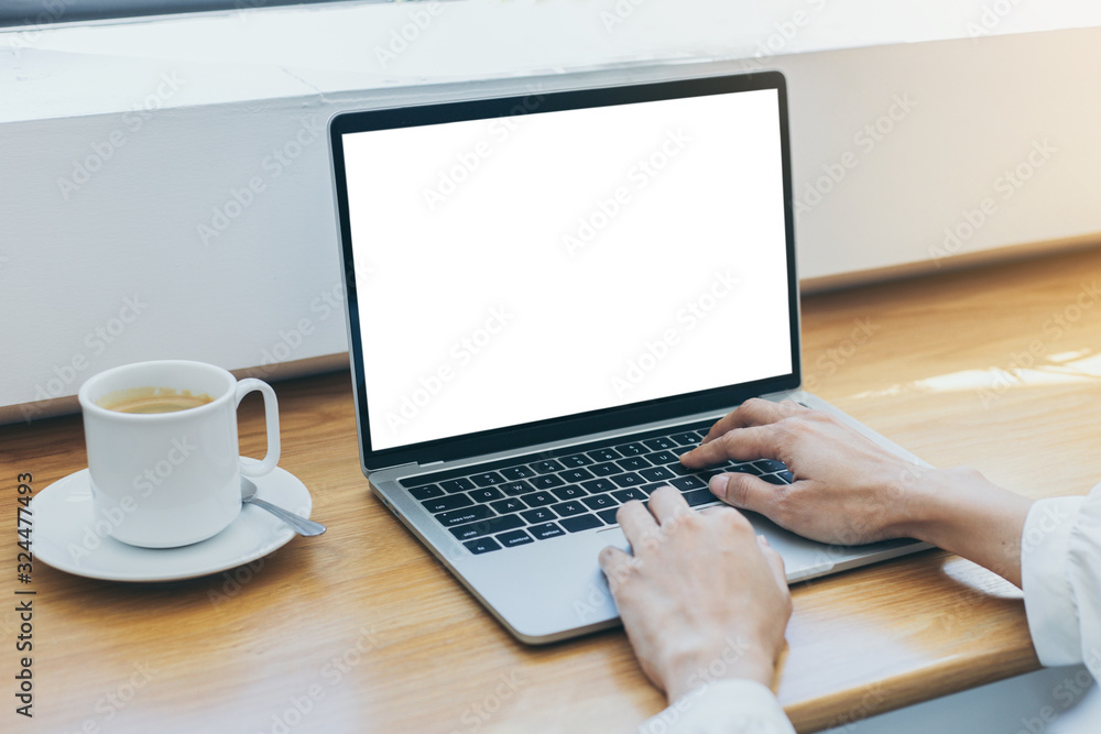 mockup image blank screen computer with white background for advertising text,hand woman using laptop contact business search information on desk at home office.marketing and creative design mockup image blank screen computer with white background for advertising text,hand woman using laptop contact business search information on desk at home office.marketing and creative design