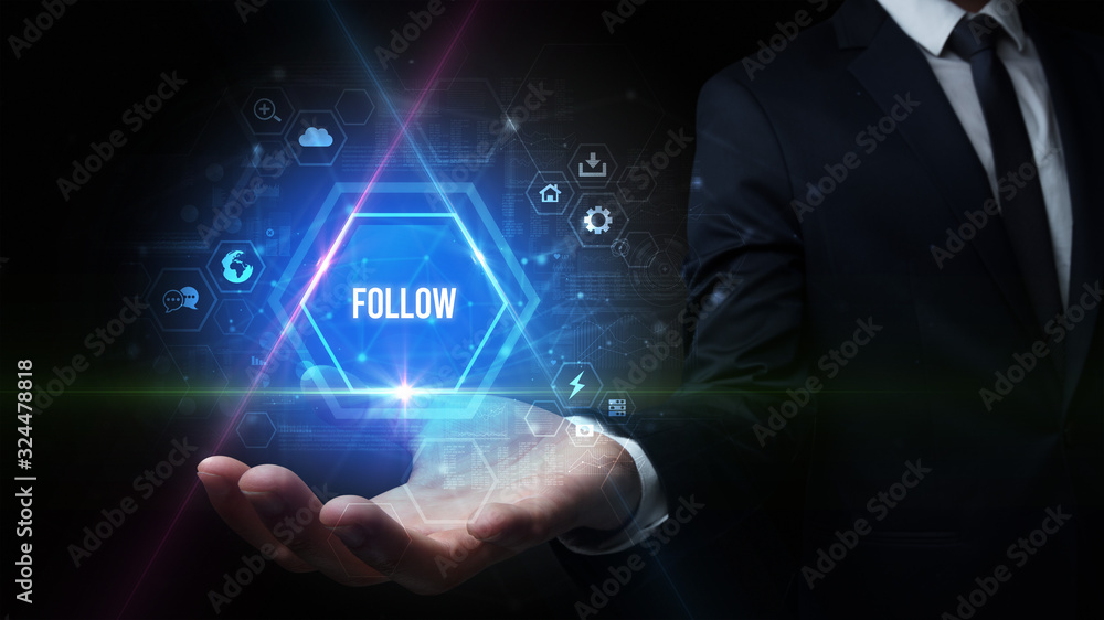Man hand holding FOLLOW inscription, social media concept Man hand holding FOLLOW inscription, social media concept