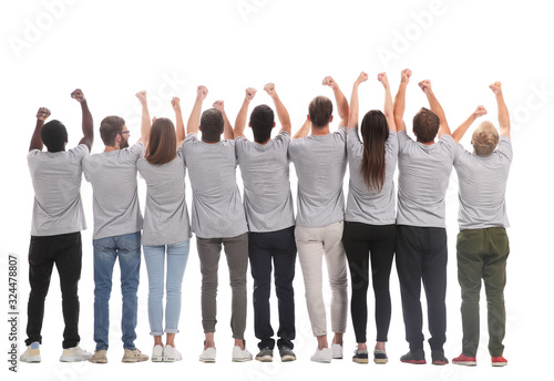 rear view. a group of young like-minded people holding their hands up