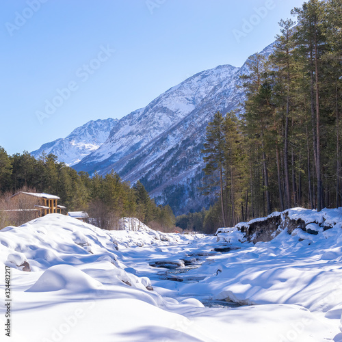 beautiful view of a snowy river in the mountains © Илан Марголин