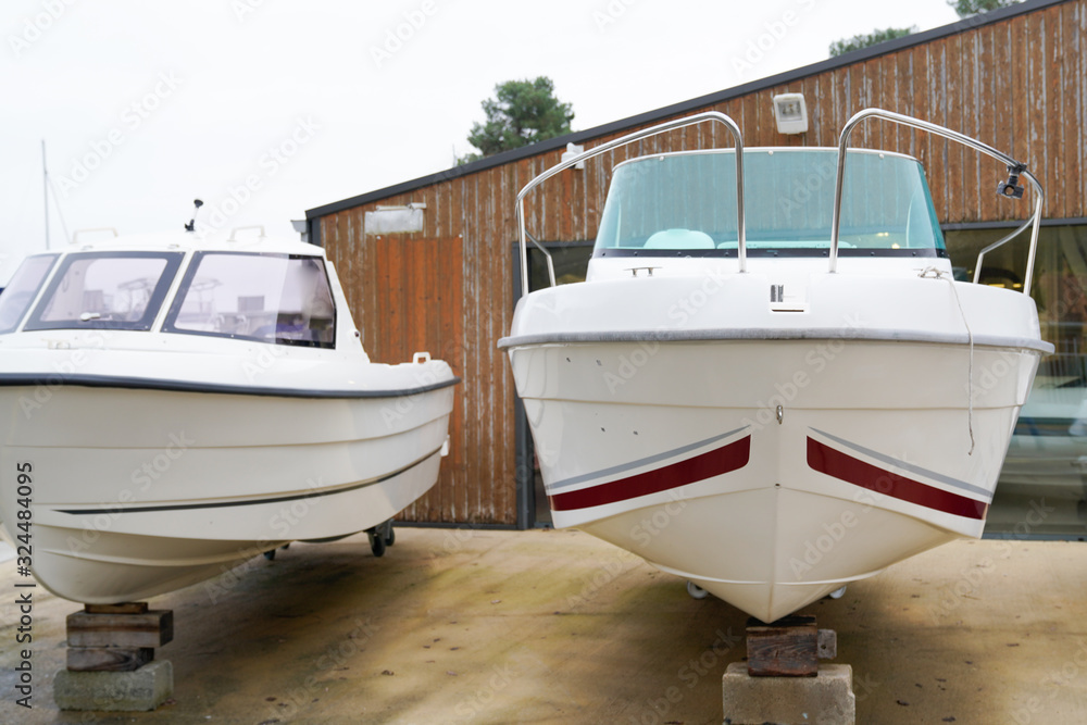 new boat for sale dealership stored up in dry storage waiting for hire rent or buy