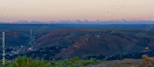 Sunrise over Green River, Wyoming. Showing the mountain monogram and Uinta Mountains in the background