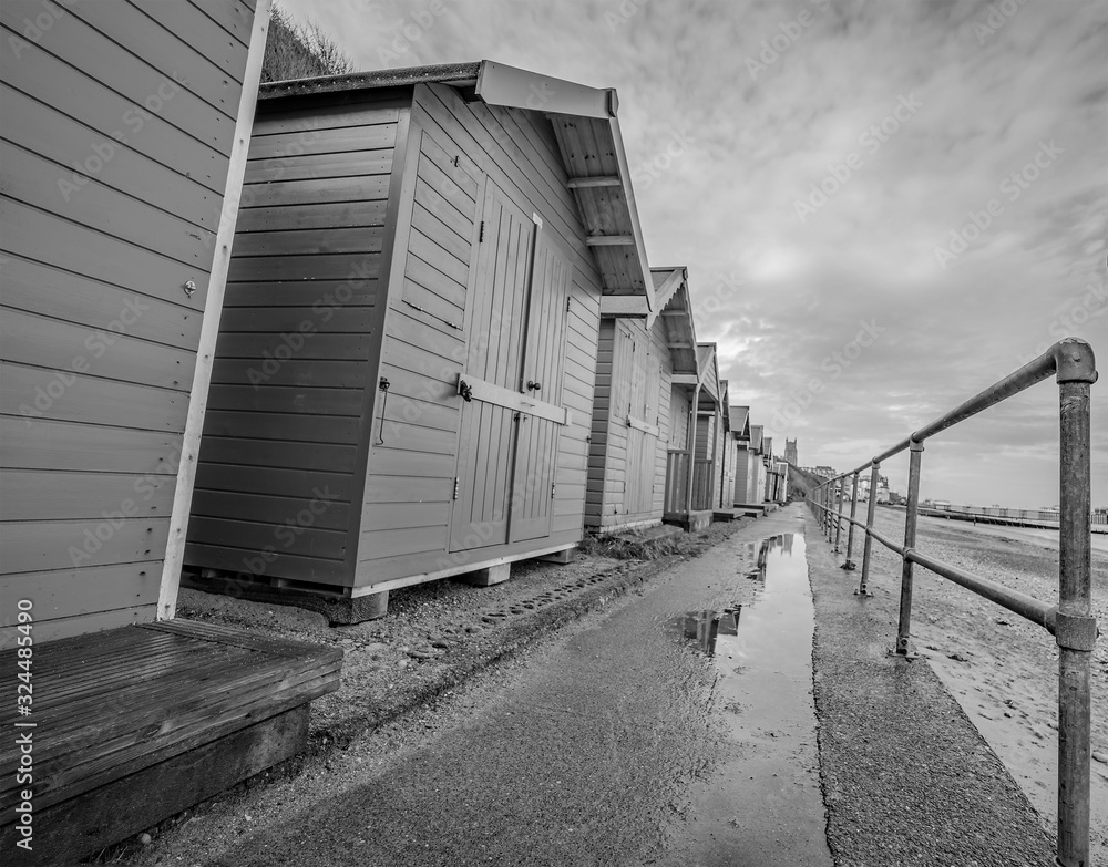 Fototapeta premium Selective focus on a row of colourful traditional wooden beach huts