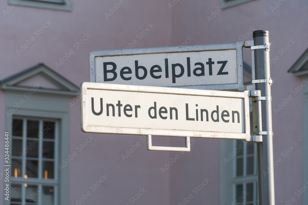 Street name signs of Bebelplatz (formerly and colloquially the Opernplatz) and of Unter den Linden in the central Mitte district in Berlin, Germany