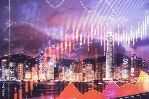 Double exposure of forex chart drawings over cityscape background. Concept of success.