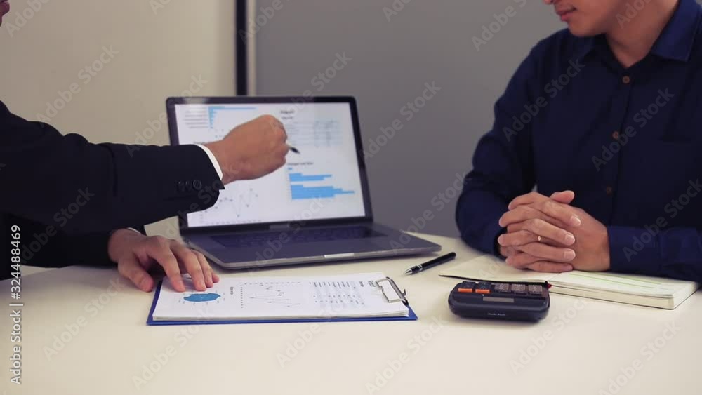 Businessmen explain about quarterly results on laptop screen with colleagues and entrepreneurs and are discussing financial planning and shaking hand at the office. Businessmen explain about quarterly results on laptop screen with colleagues and entrepreneurs and are discussing financial planning and shaking hand at the office.