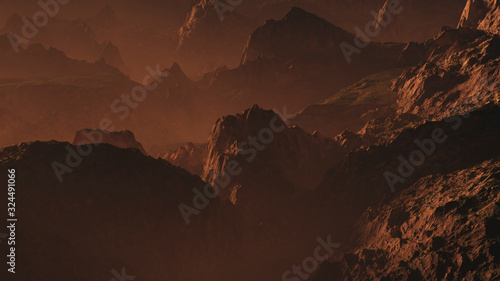 Rugged mountains at hazy sunset.