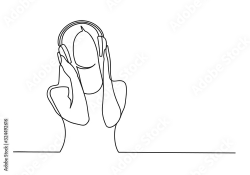 Beautiful woman with headphones listening to music