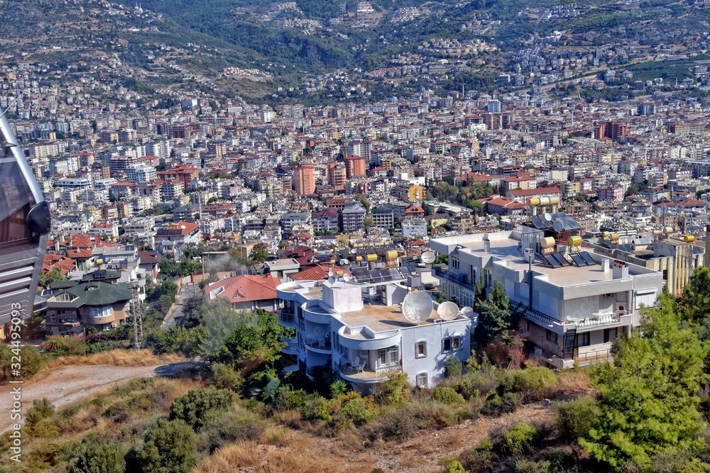 urban landscape of Alanya in Turkey in the mountains on buildings on a warm summer day