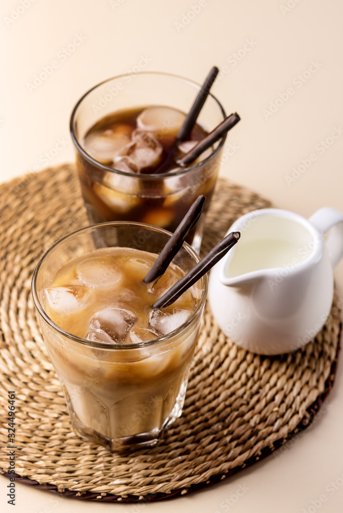 Cold Coffee Drink with Ice and Milk Iced Black Coffee Glass of Refreshing Summer Drink Vertical Above Cold Coffee Drink with Ice and Milk Iced Black Coffee Glass of Refreshing Summer Drink Vertical Above