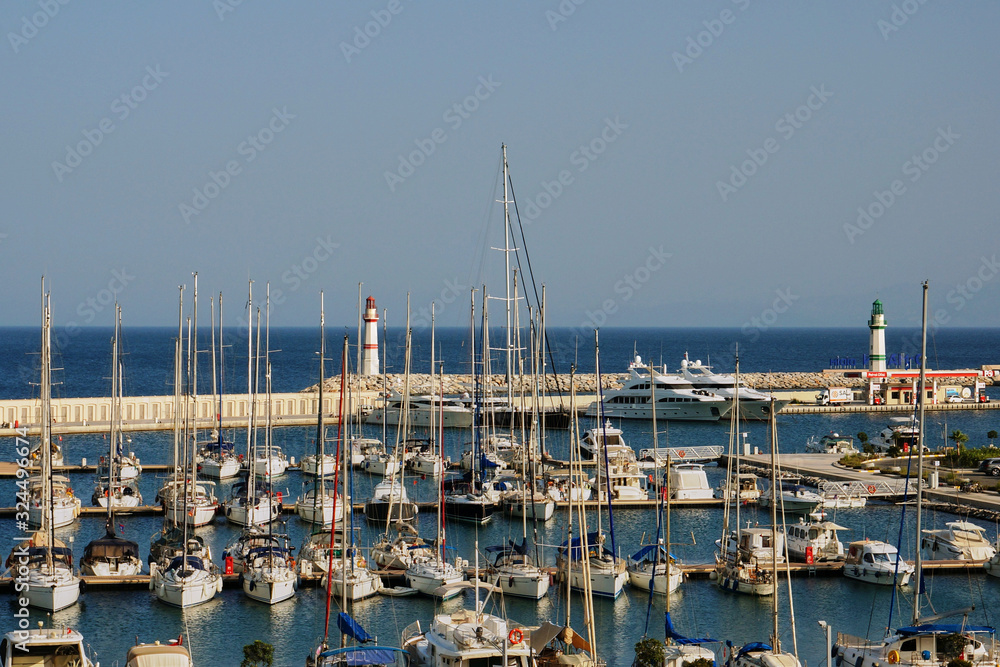 Yachts with lowered sails in the Marina