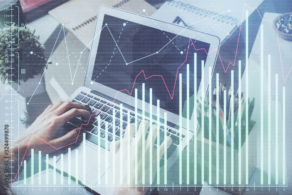 Double exposure of stock graph with businessman typing on computer in office on background. Concept of hard work. Double exposure of stock graph with businessman typing on computer in office on background. Concept of hard work.