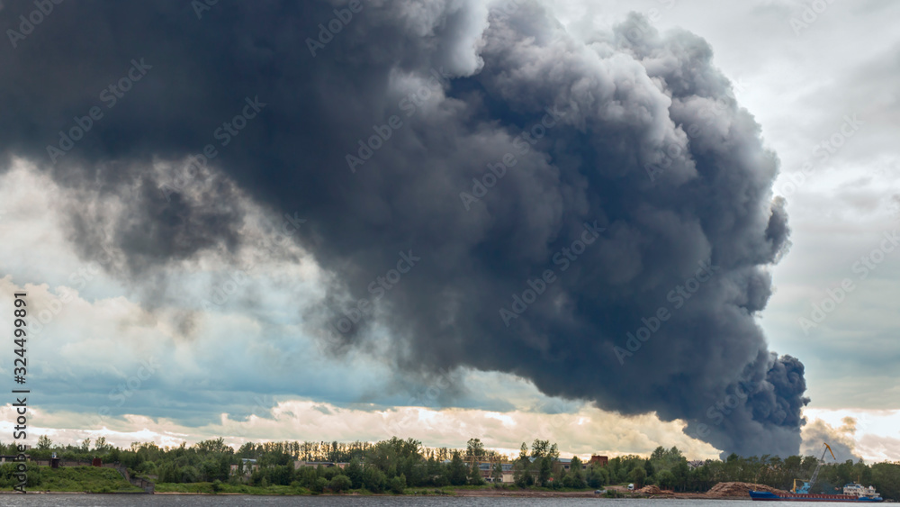 dangerous cloud of black smoke closeup as background.