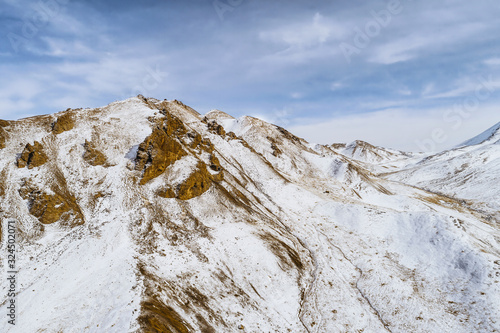 lanscape with barren mountain which is covered with ice