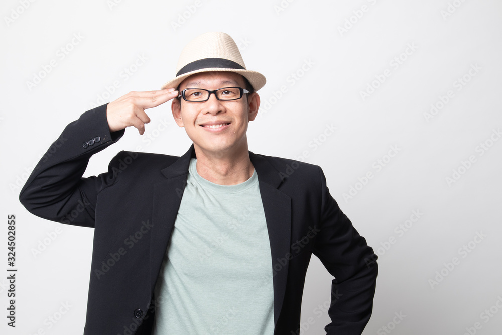 adult asian man holding fingers in gun gesture. adult asian man holding fingers in gun gesture.