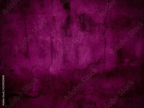 Dark pink cracked cement background that is old.