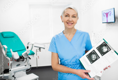 Portrait of a mature gynecologist. Doctor smiling and looking at the camera. Gynecology