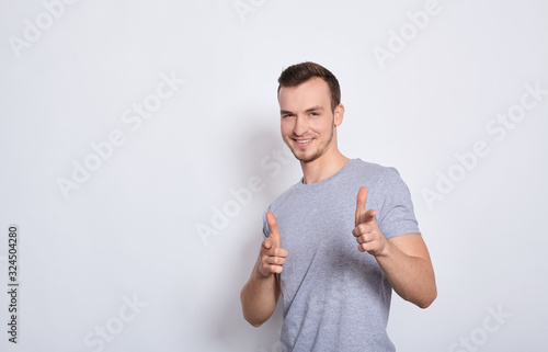 Hilarious happy young guy shows fingers like.