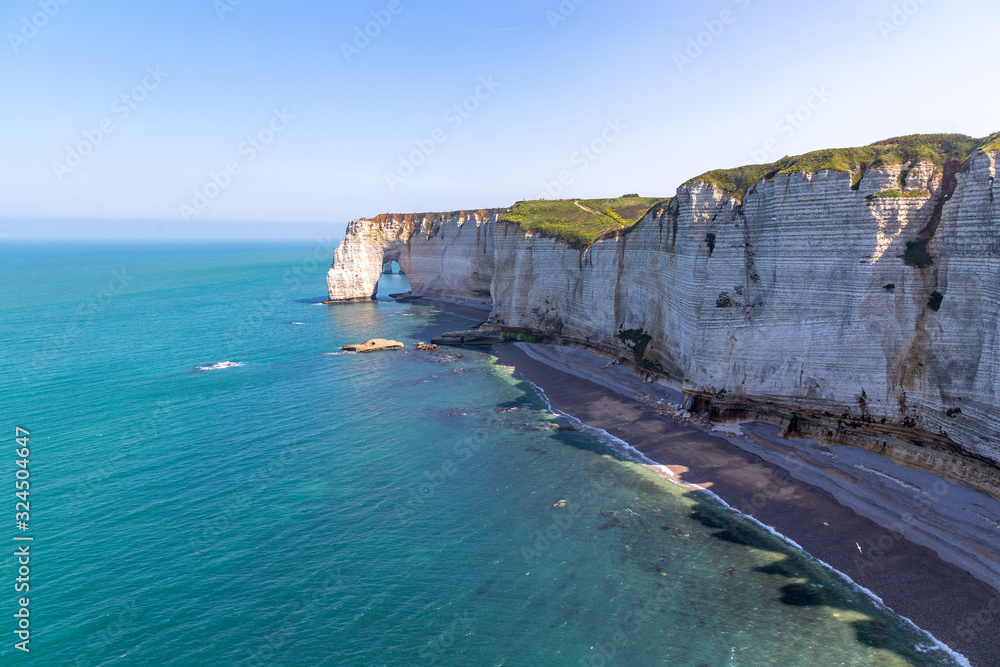 Rocks on the coast of the English channel strait. Etretat village, Normandy region, France. Rocks on the coast of the English channel strait. Etretat village, Normandy region, France.