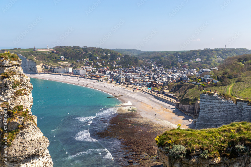 Rocks on the coast of the English channel strait. Etretat village, Normandy region, France.