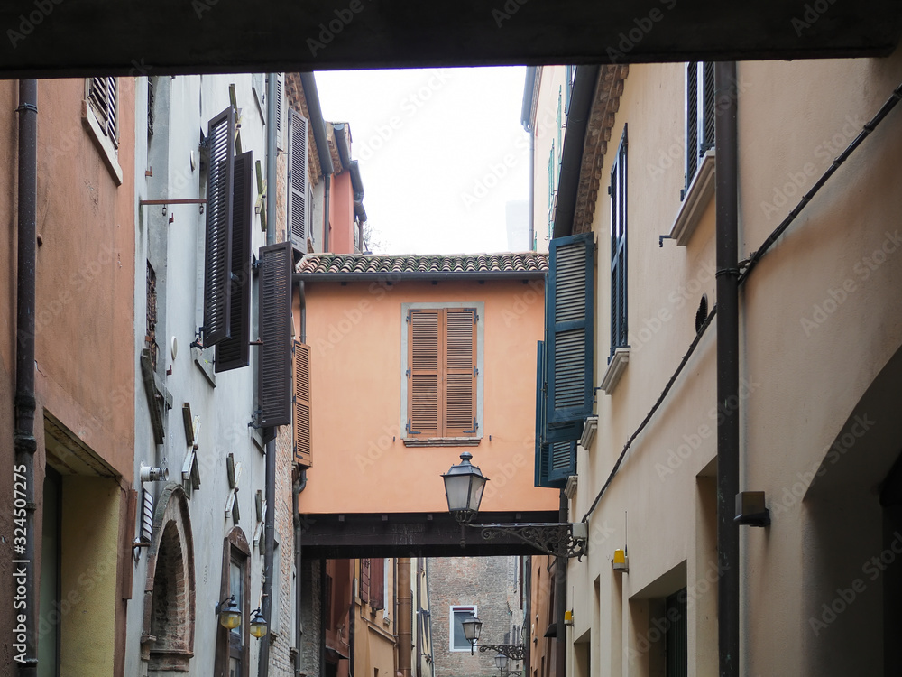 Ferrara, Italy. Medieval zone, ancient street. Window and archway.