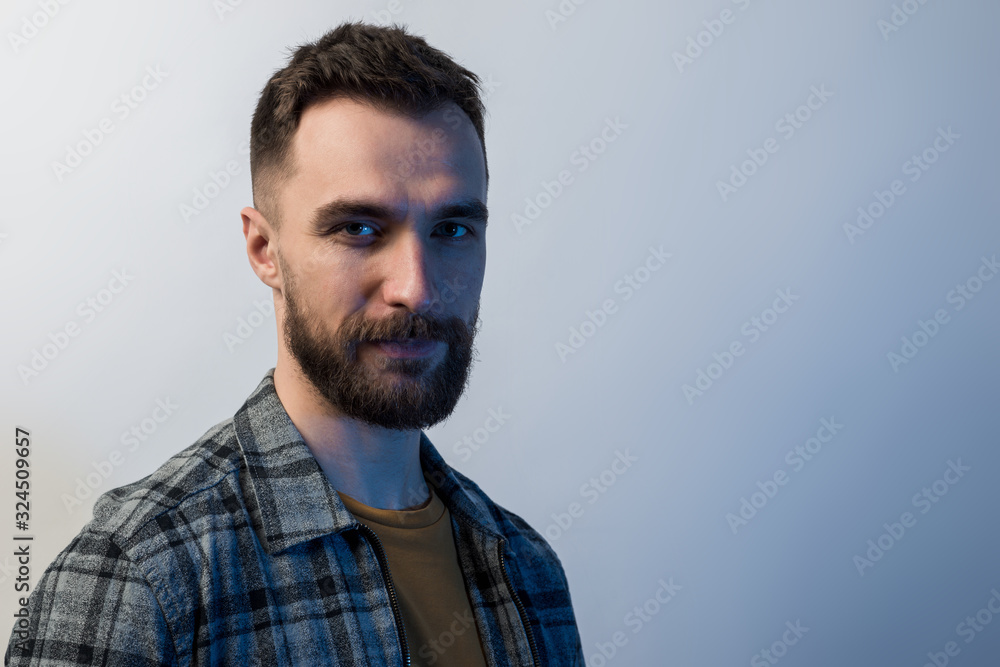 Closeup portrait of young man with charming glance. - Face male portrait Closeup portrait of young man with charming glance. - Face male portrait
