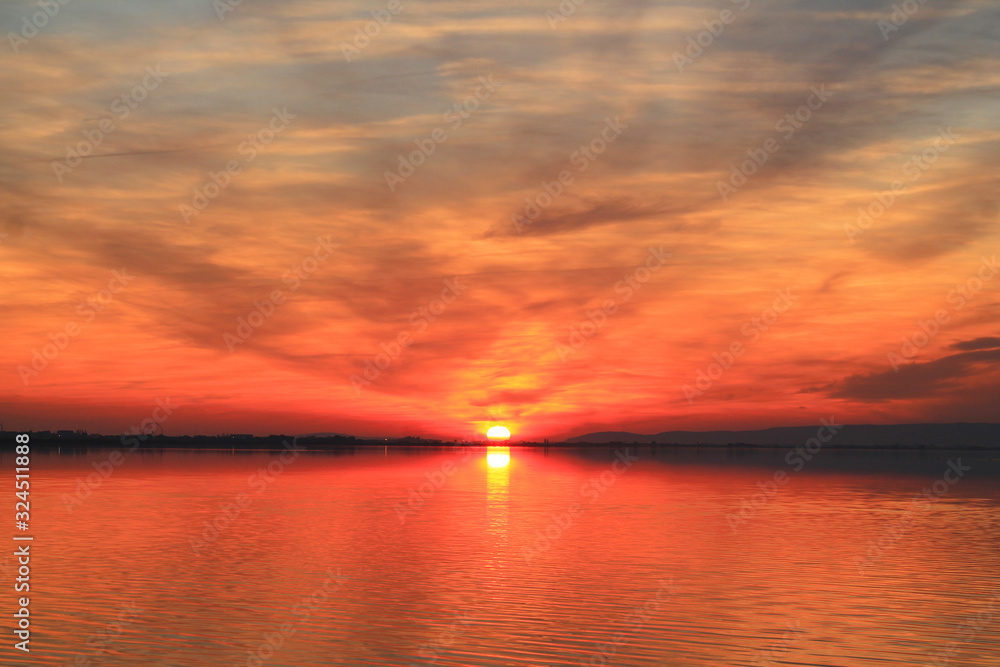 Naklejka premium Amazing sunset in the natural Mejean lagoon, a protected wetland in Montpellier, France