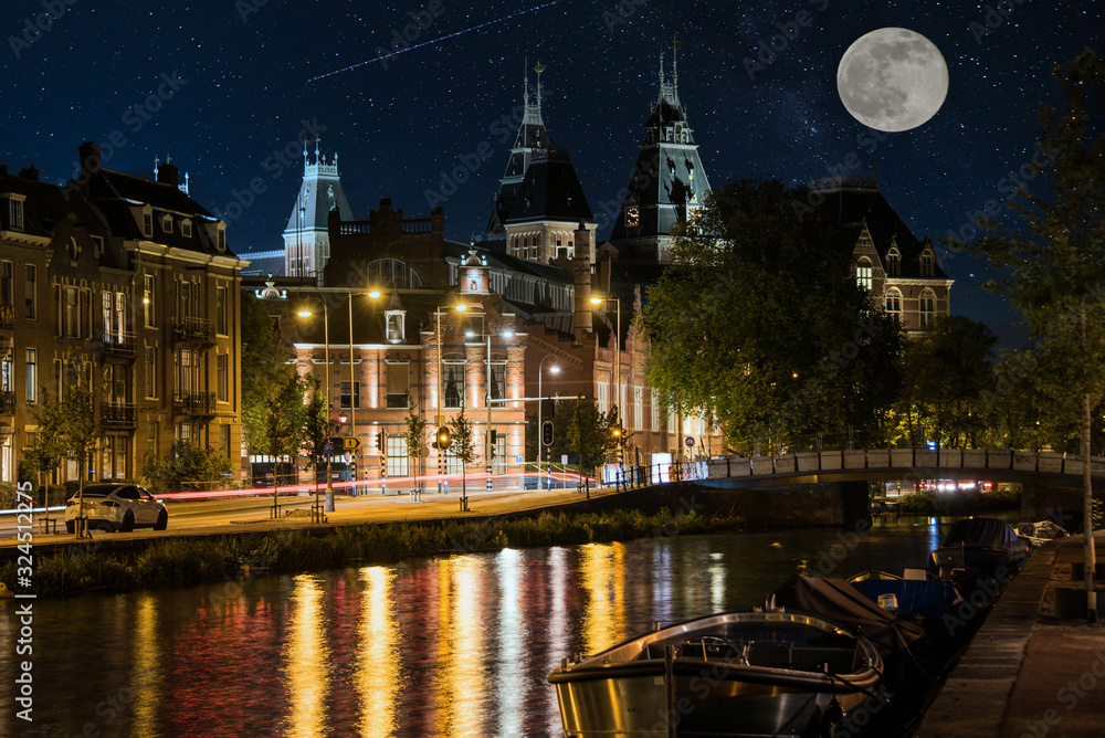 Moon over Amsterdam at Night with a Canal and Reflections