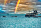 Rainbow over the Blue Adriatic Sea with a Traditional Fishing Platform