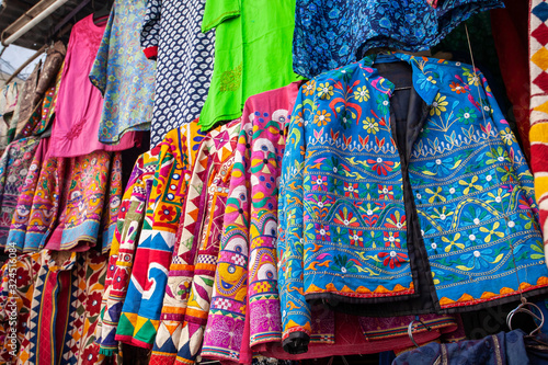 Traditional Indian clothes and accessories market at Udaipur city, Rajasthan, India