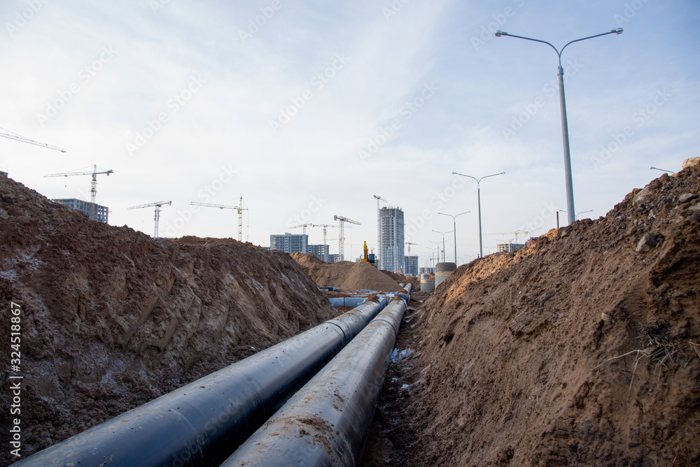 Laying of underground storm sewer pipes at the construction site ...