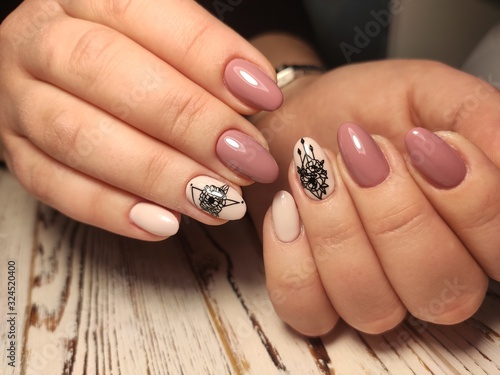 Beautiful woman's nails with beautiful christmas manicure