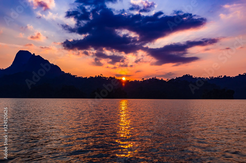 Sunset at Khao Sok National Park, Cheow Lan Lake, Thailand photo