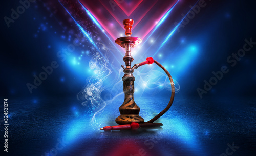 Hookah with smoke on a dark abstract background. Background of party, neon lights, smoke, smog.