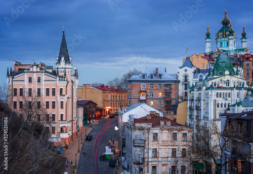 View to Old District Podil of Kyiv city from Zamkova Hill at sunset.