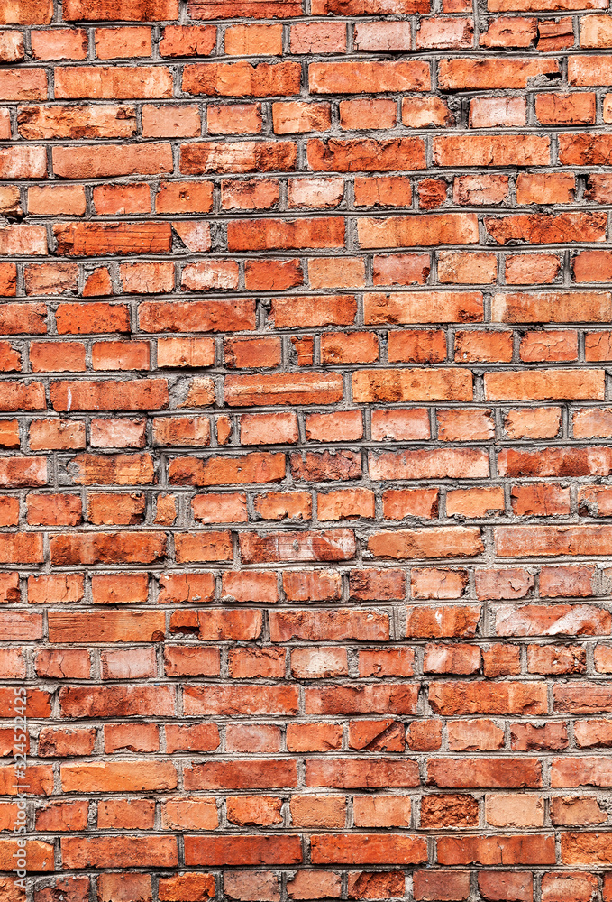 Naklejka premium Red brick wall as background texture