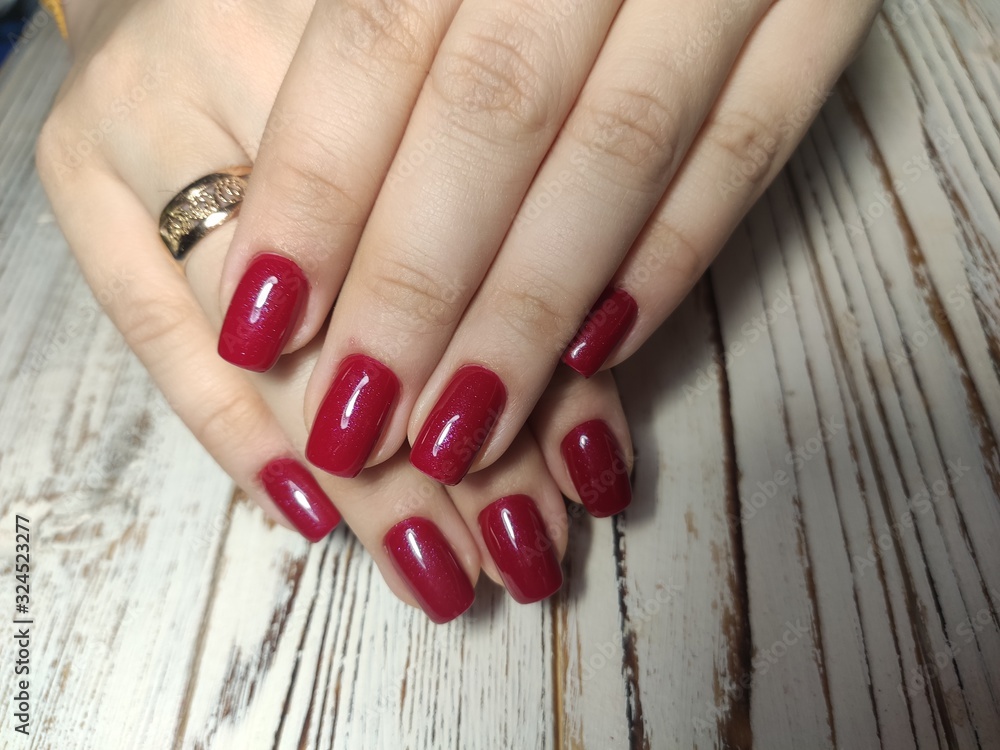 beautiful gel lacquer manicure on a textured background beautiful gel lacquer manicure on a textured background